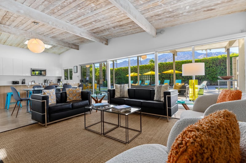 Relax in your bright living space with stunning mountain views, cozy seating, and seamless indooroutdoor flow to the pool area.