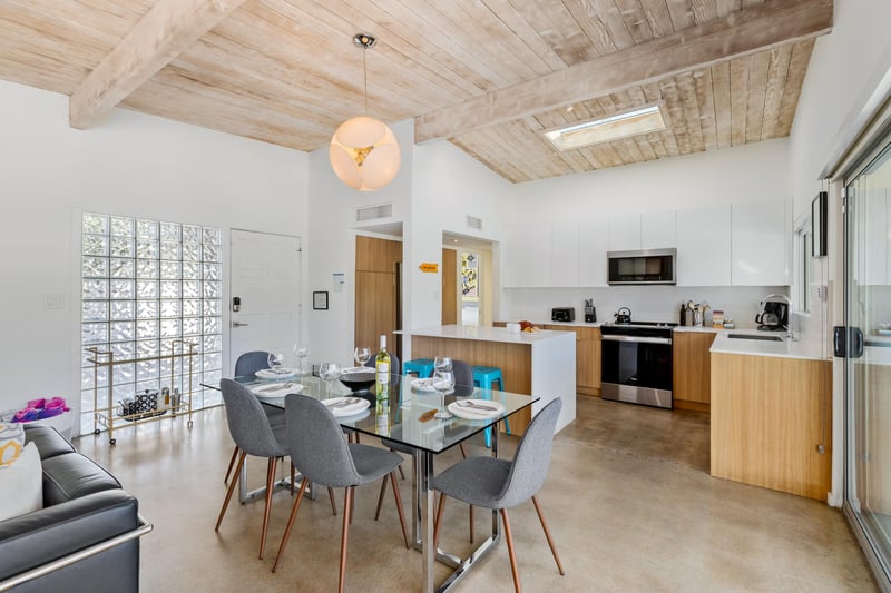 Step into your modern openplan haven where exposed wood beams meet sleek design. Cook, dine, and relax in this lightfilled space with contemporary furnishings.