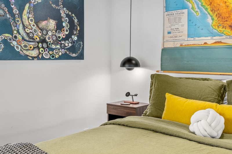 Sink into soft linens surrounded by vibrant art and thoughtful touches that make your stay feel like home.