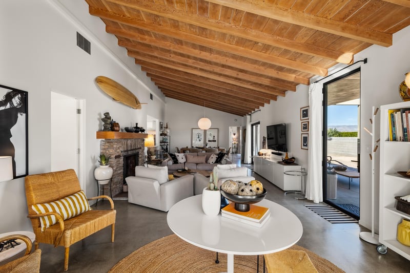 Stylish living room with wood beam ceilings