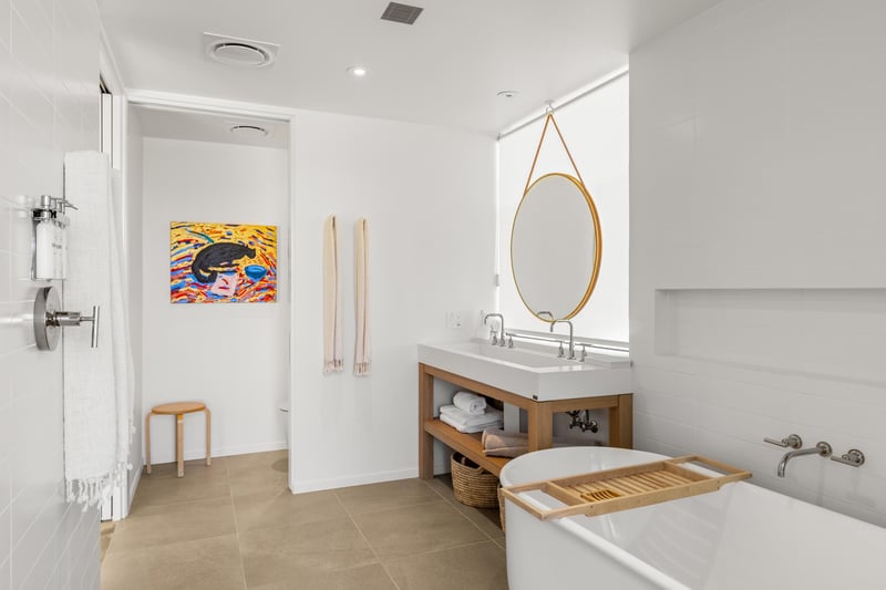 Serene bathroom featuring indooroutdoor shower