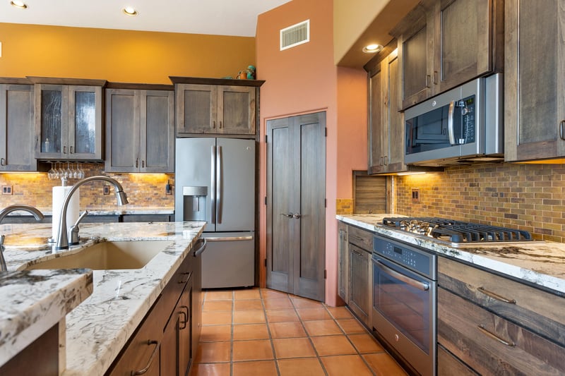 Kitchen complete with staninless steel appliances.