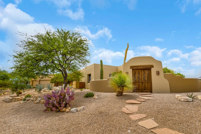 Front of property with view of side gate
