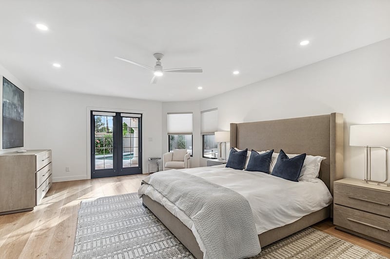 Master bedroom  King sized bed and french doors leading to pool area