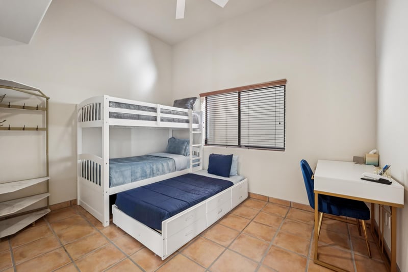 Downstairs guest bedroom with single bed bunks and twin trundle.