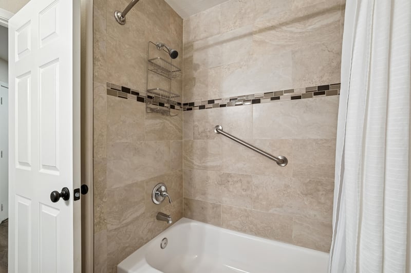 Relax in our guest bathroom with tub  shower combo.