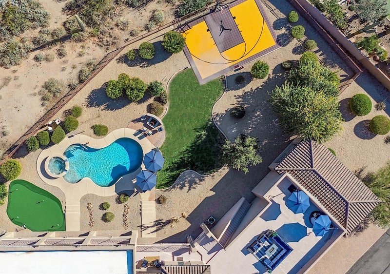 Aerial view of backyard and rooftop patio