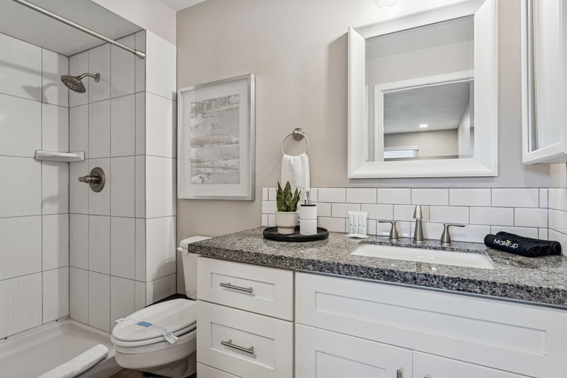 Primary bathroom with spacious walk in shower.