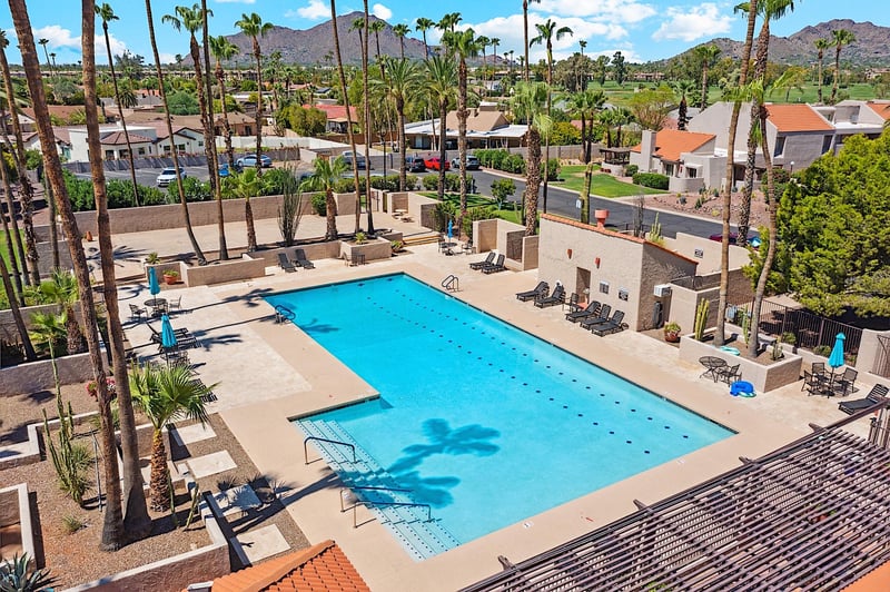 The wellkept community keeps loungers, pool umbrellas, and some bistro tables first come, first serve