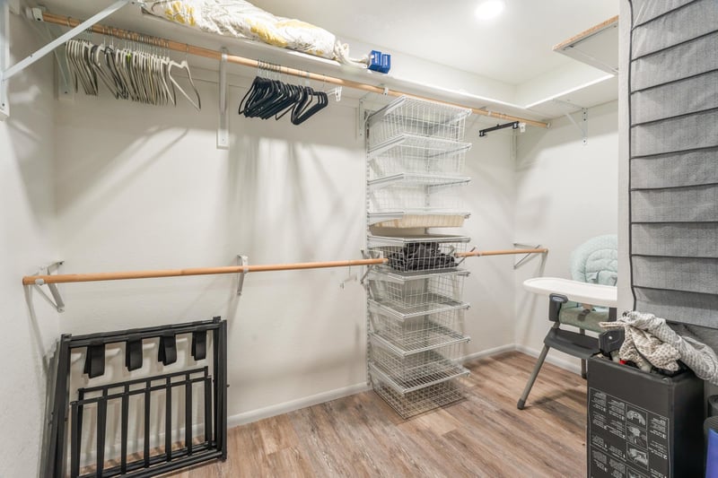 Master Closet With Packn Play and Highchair