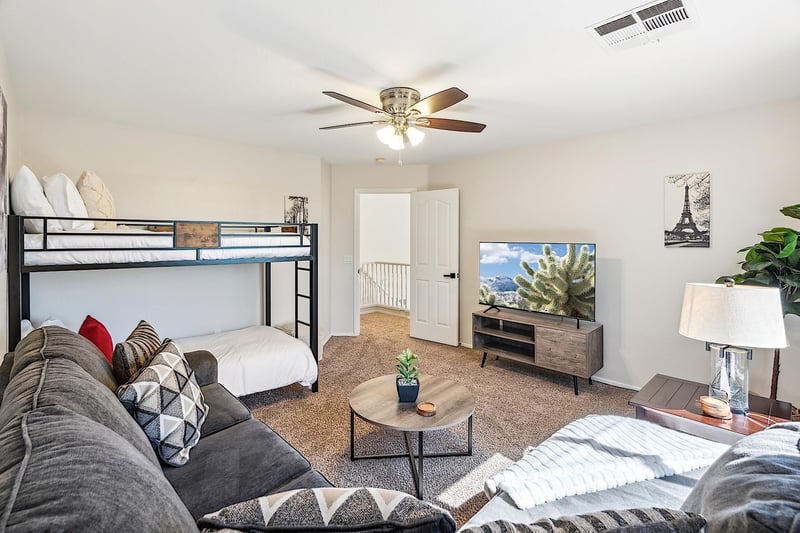 Twin bunkbed, sectional sofa and 55 Smart TV