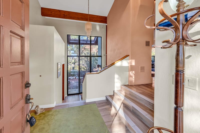 Foyer With Stairs Leading To Bedrooms Down Stairs