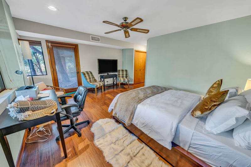 Master Bedroom With Desk And Access to Covered Patio