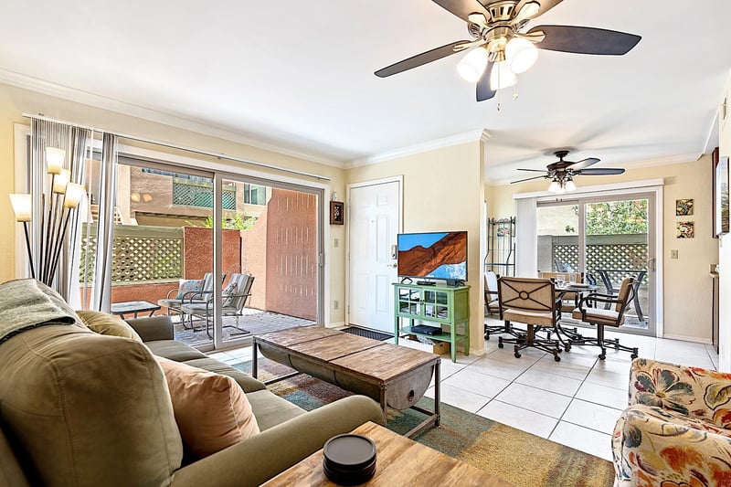 Living room looking into dining area  kitchen and second patio