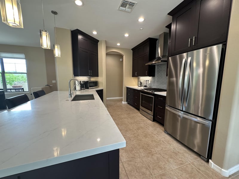 Large fridge with stainless steel appliances.