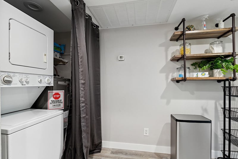 Stacked washer and dryer in unit.