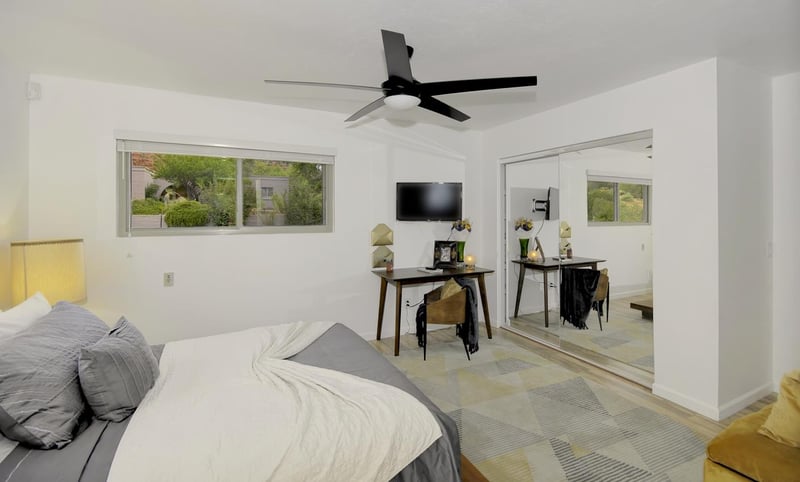 Master bedroom with desk and TV