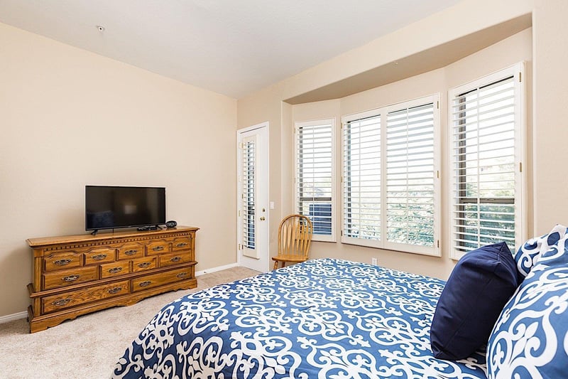 Master bedroom Flat screen TV with cable and access to upper level patio with a KING bed.