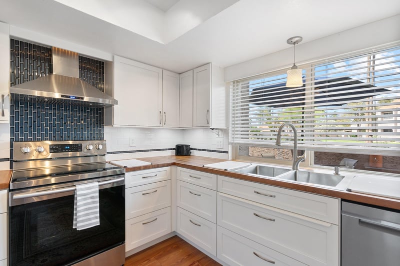 The window above the kitchen sink provides the space with ample bright light and a view to the world.