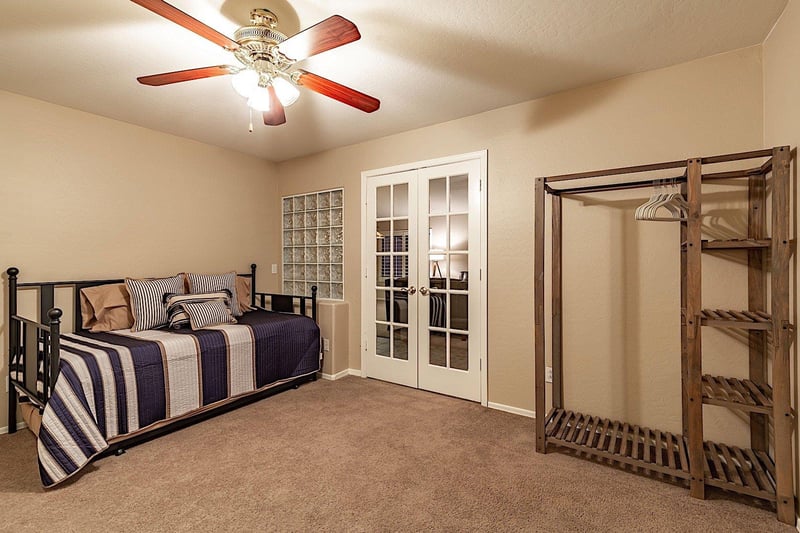 Office space with trundle bed and clothing storage