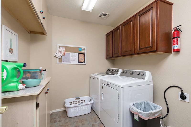 Full size washer and dryer in utility room