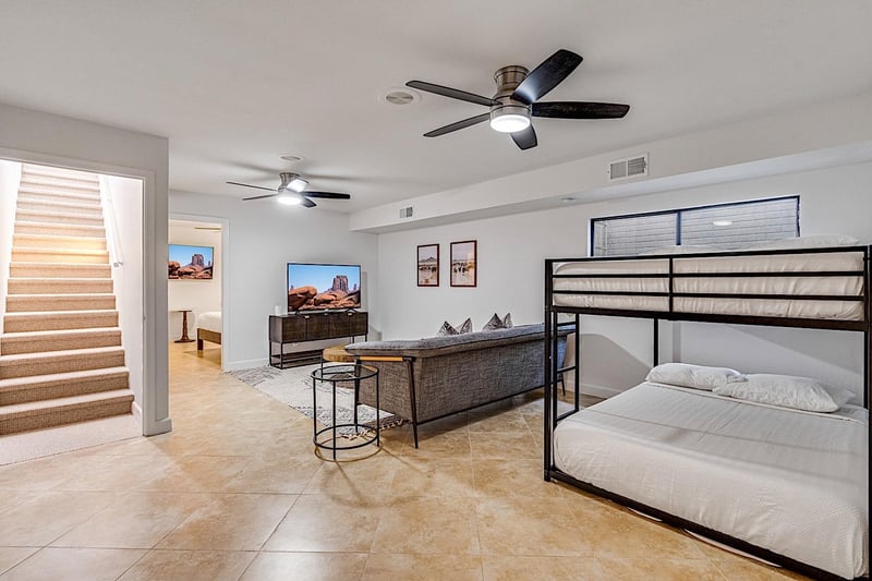 Basement living room with queen over queen bunkbeds