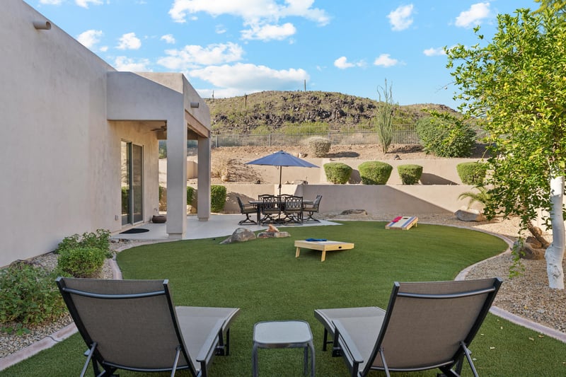 Relax on the east patio with seating for six, admire mountain views, and challenge friends to cornhole