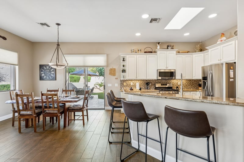 The kitchen has a skylight and plenty of seating around the breakfast bar