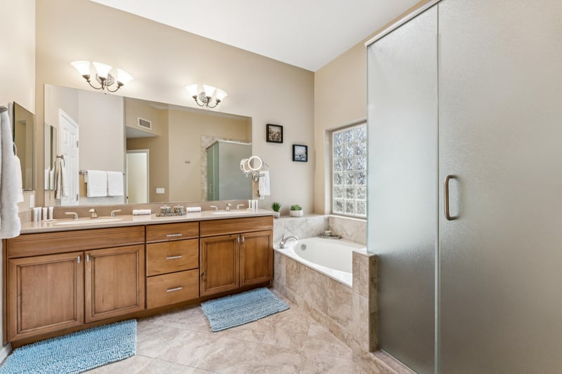Spalike bathroom featuring Jack  Jill sinks and a convenient makeup station