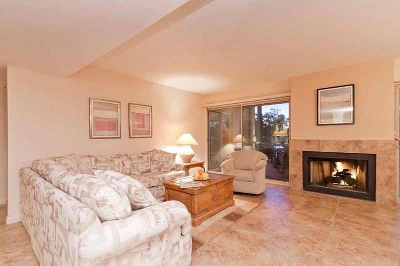 Living area with golf course views , water feature views, and fireplace. there are bald eagles soaring above regularly.