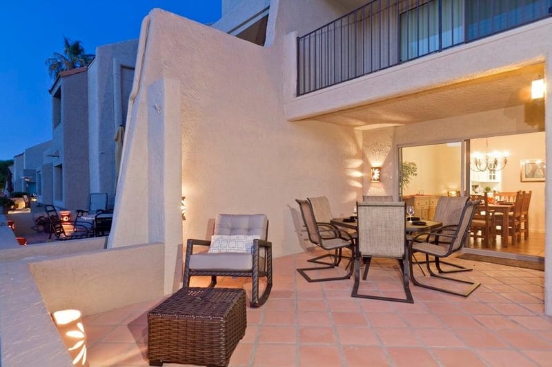 Expansive patio which is half covered, half open, with outdoor table and chairs to accommodate meals for 6.