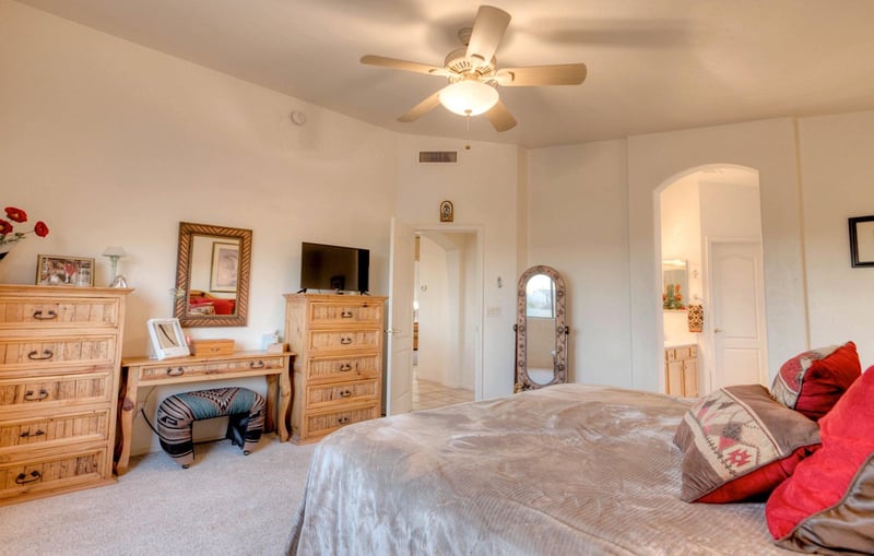 Spacious master bedroom with vanity setup