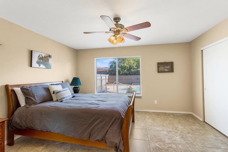 Master Bedroom Queen Bed and view of pool