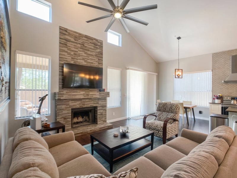 Calming fireplace enhances open concept living space.