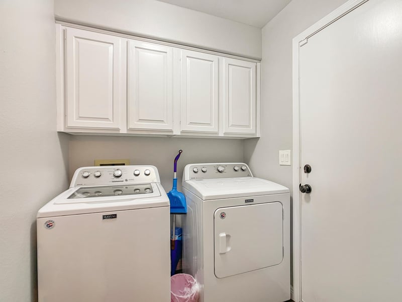 Washer and dryer on main floor across from main suite.