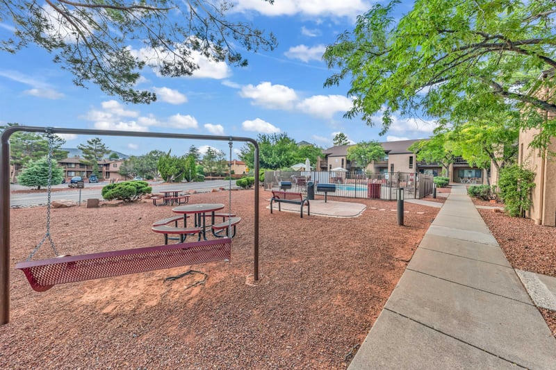 Recreational Area With BBQ, Swing, And Seating Area