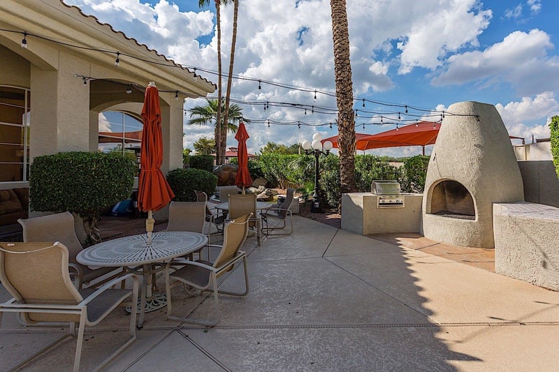 Community grilling, overhead tea lights, and an outdoor fireplace invite you to enjoy a warm evening outdoors