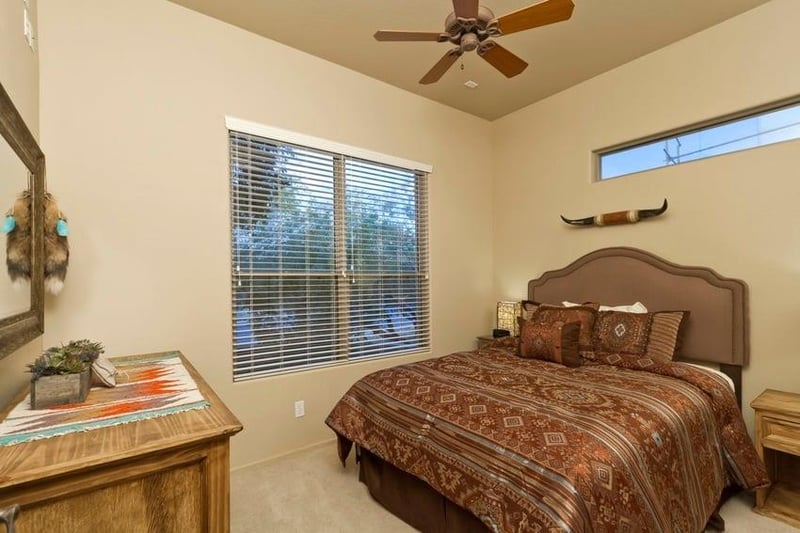 Rich chocolate tones cover this bed and warm the bedroom