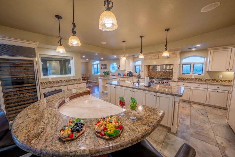 This Kitchens Custom Design Includes A Chefs Table That Is Perfect For Entertaining
