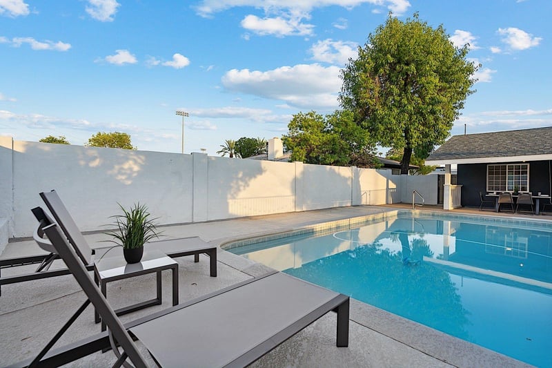 Sparkling pool and sun loungers