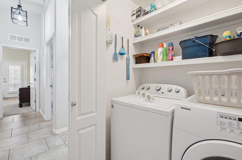 Convenient inhome Washer and Dryer stocked with some cleaning supplies