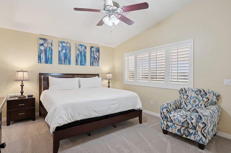 Spacious main bedroom has shuttered windows for plenty of natural light providing a clean and airy feel