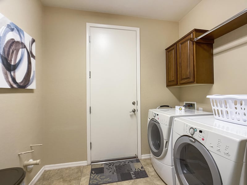 Laundry room off of two car garage.