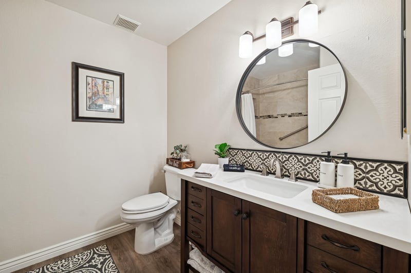Guest bathroom with open space vanity.