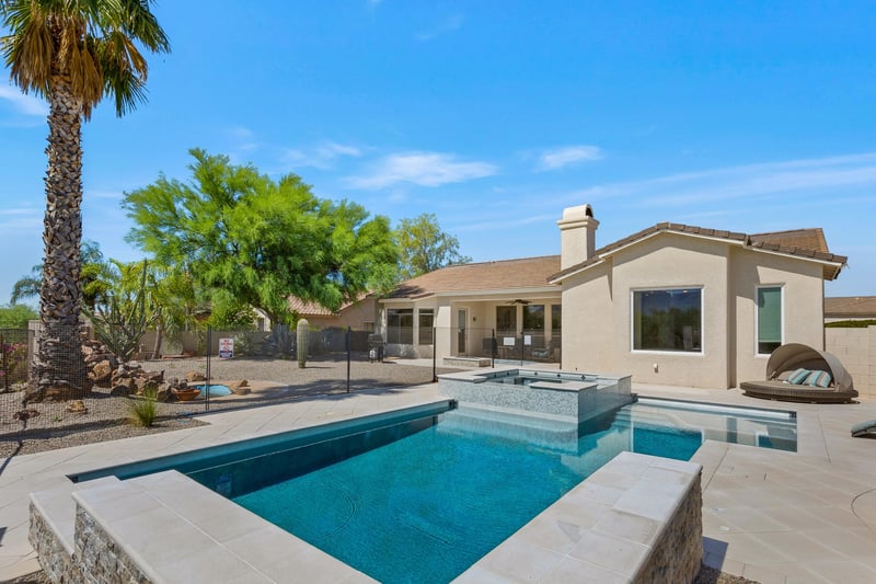 Fenced in pool area in backyard
