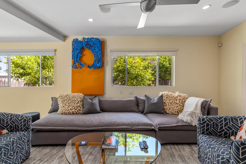 Features a queen size bed, own sitting area, smart TV, patio access, and ensuite bathroom.