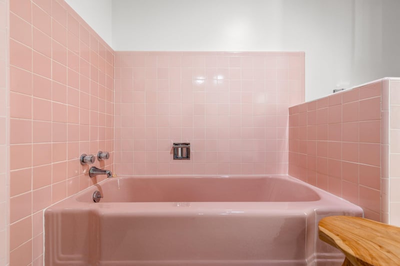 Ensuite bathroom with standalone shower, tub, and beautiful pink tile