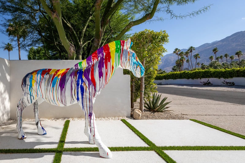 Colorful zebra sculpture near front gate ready to welcome guests.