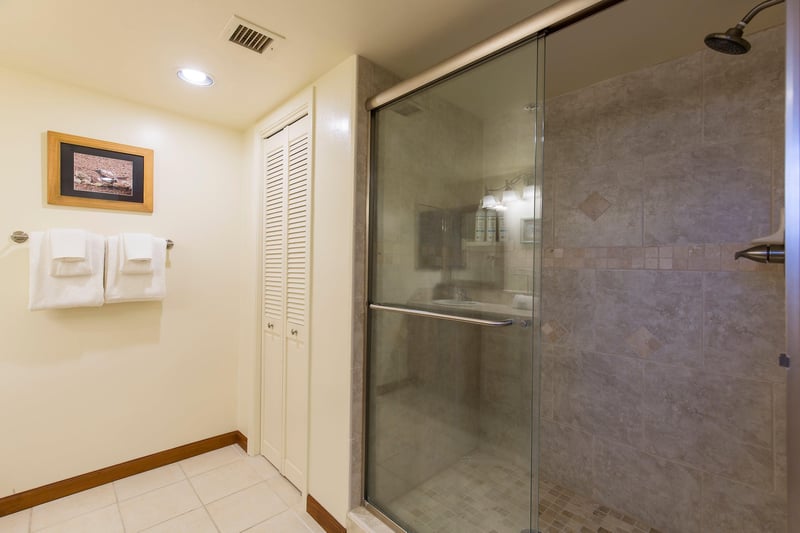 Dual vanity sink, stand alone shower, and plenty of cabinet space.