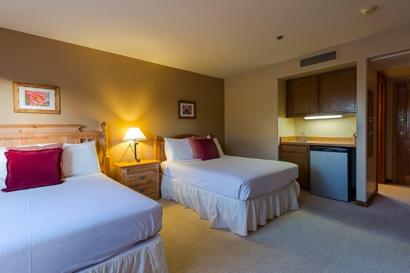Two full size beds, desk, and kitchenette.